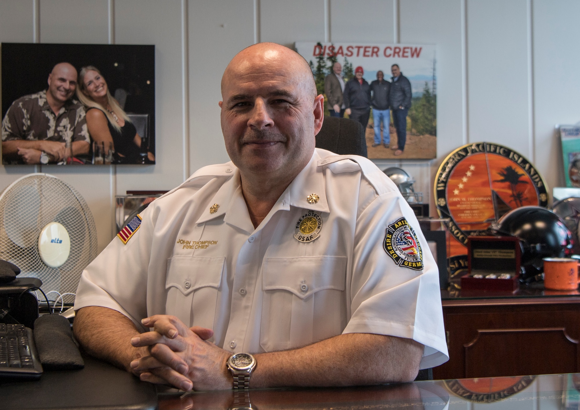 Fire Chief John Thompson, 86th Civil Engineer Squadron fire chief, has his photo taken at his desk, Ramstein Air Base, Germany, April 13, 2020.