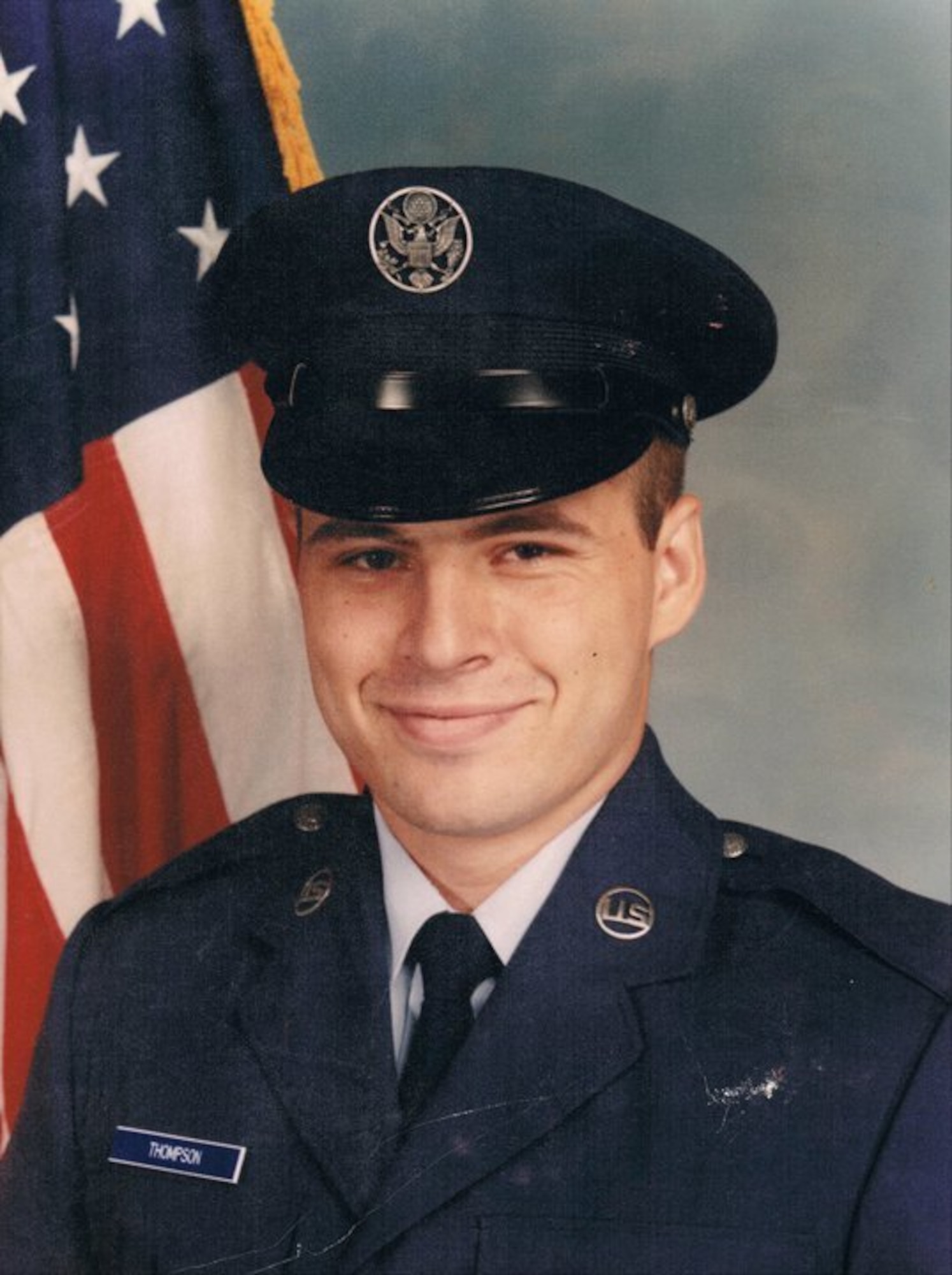 Then U.S. Air Force Airman John Thompson poses for his official photo at Lackland Air Force Base, Texas, July 1983.
