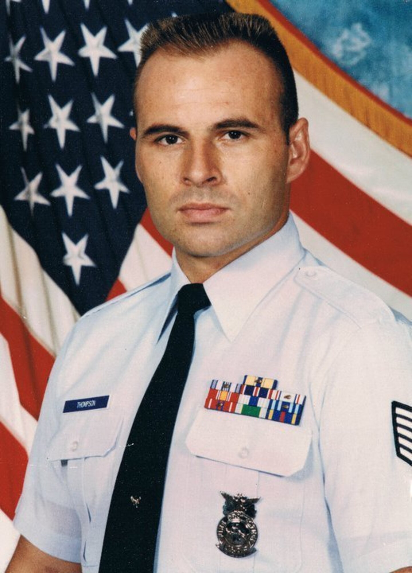 Then U.S. Air Force Tech. Sgt. John Thompson has his official photo taken at Anderson Air Force Base, Guam, 1994.