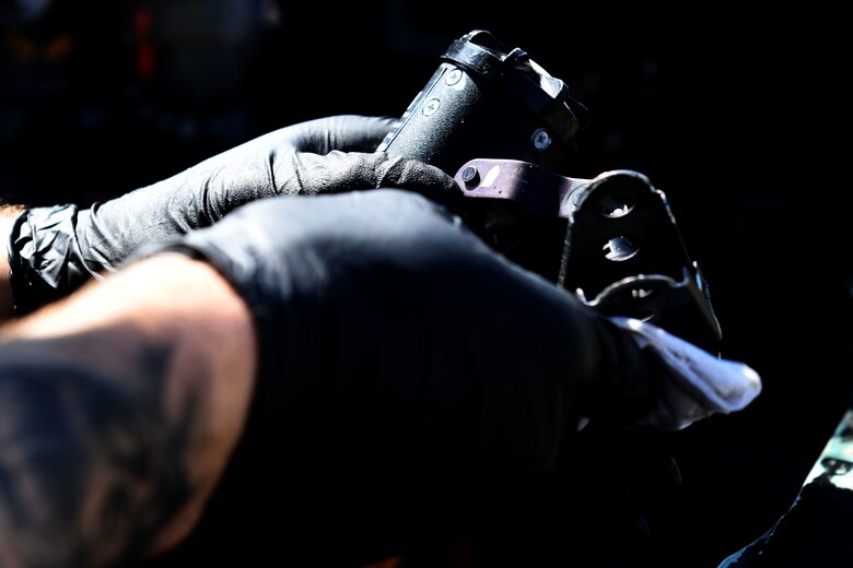 A 493rd Aircraft Maintenance Unit crew chief sanitizes an F-15C Eagle cockpit tool to prevent the spread of COVID-19 at Royal Air Force Lakenheath, England, April 15, 2020. Crew chiefs are required to take safety precautions to help protect themselves and other aircrew who may come in contact with the aircraft. (U.S. Air Force photo by Senior Airman Christopher S. Sparks)
