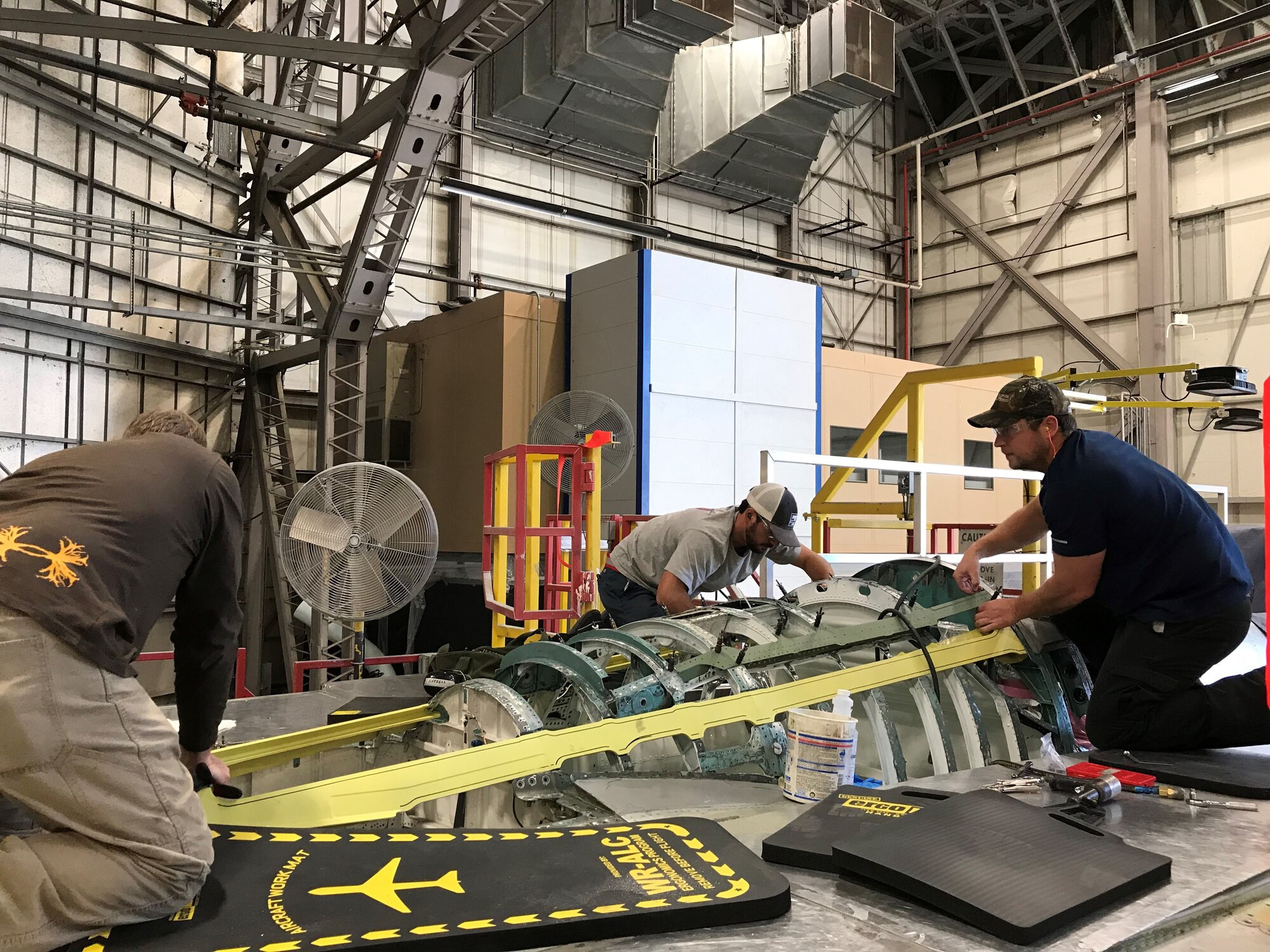 aircraft mechanics working on F-15