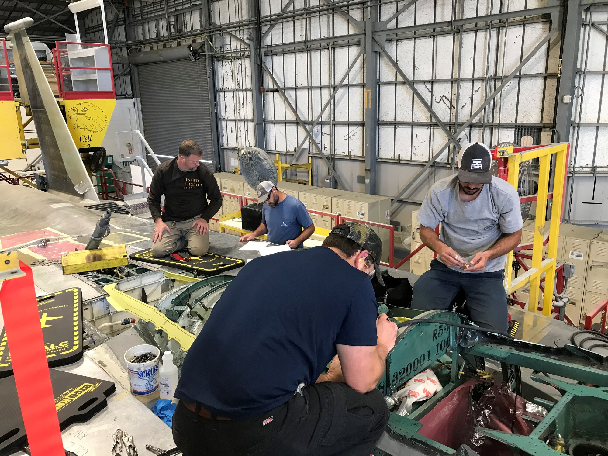 aircraft mechanics working on F-15