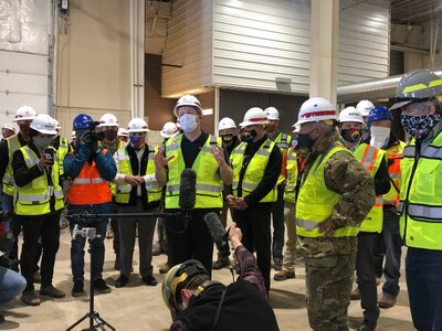 Gov. Jared Polis, center, and U.S. Army Lt. Gen. Todd Semonite, U.S. Army Corps of Engineers commanding general and 54th U.S. Army Chief of Engineers, visit The Ranch Events Complex, Loveland, Colo., April 14, 2020. The Ranch was identified by the state for use as a medical shelter during the COVID-19 response. The Colorado National Guard is helping convert the Colorado Convention Center, Denver, as another medical shelter.