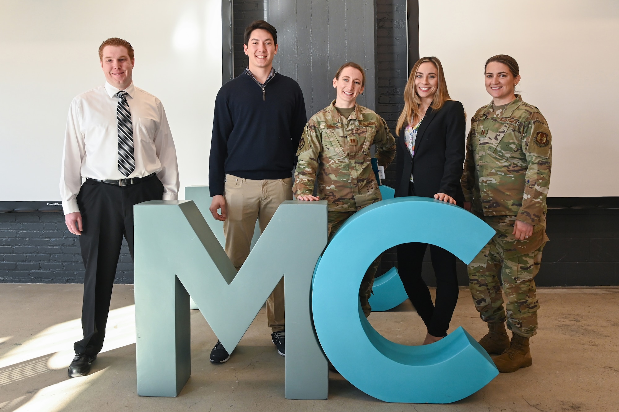 Brian Carr, director of innovation for Command, Control, Communications, Intelligence and Networks, from left, Christian Melton, senior partnerships manager for MassChallenge Boston, Capt. Amanda Rebhi, chief innovation officer for Digital, Stacy Simon, Small Business lead for Digital, and Capt. Teresa Doskey, a contracting officer for Digital’s Force Protection Division, pause for a photo during a partnership meeting at MassChallege in Boston, Mass., Feb. 21.
