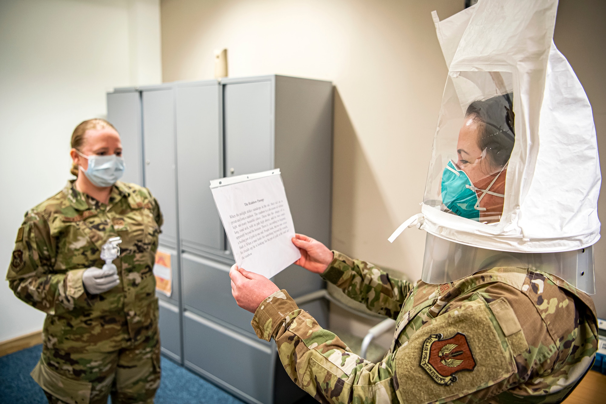 U.S. Air Force Staff Sgt. Jennalyse Adam, 423d Medical Squadron dental assistant, reads a prompt as part of a qualitative fit test for a N95 mask, April 14, 2020, at RAF Alconbury, England. The 423d MDS were conducting fit tests of the N95 mask to ensure their personnel would be safe to treat patients who had contracted the coronavirus. The 423d MDS were conducting fit tests of the N95 mask to ensure their personnel would be safe to continue to treat patients who had contracted the coronavirus. (U.S. Air Force photo by Senior Airman Eugene Oliver)