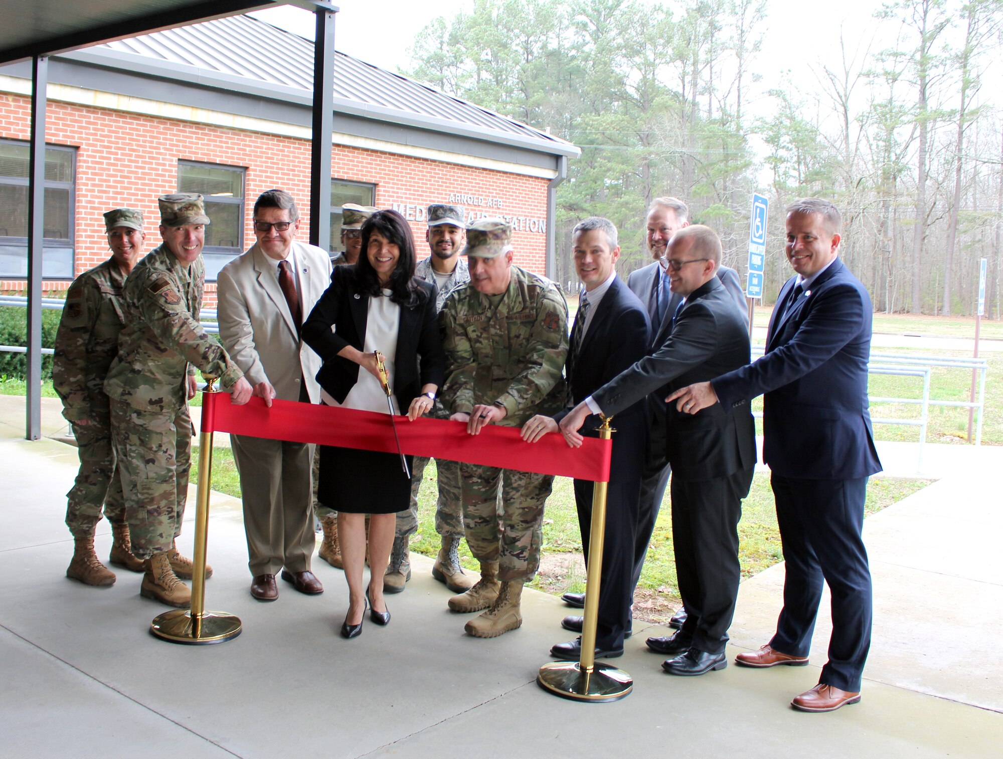 Arnold Engineering Development Complex team members, Tennessee Department of Veterans Services representatives and community leaders assist in cutting the ribbon March 12, 2020, for the new Tennessee Department of Veterans Services office located in the Medical Aid Station at Arnold Air Force Base, Tenn. (U.S. Air Force photo by Deidre Moon)