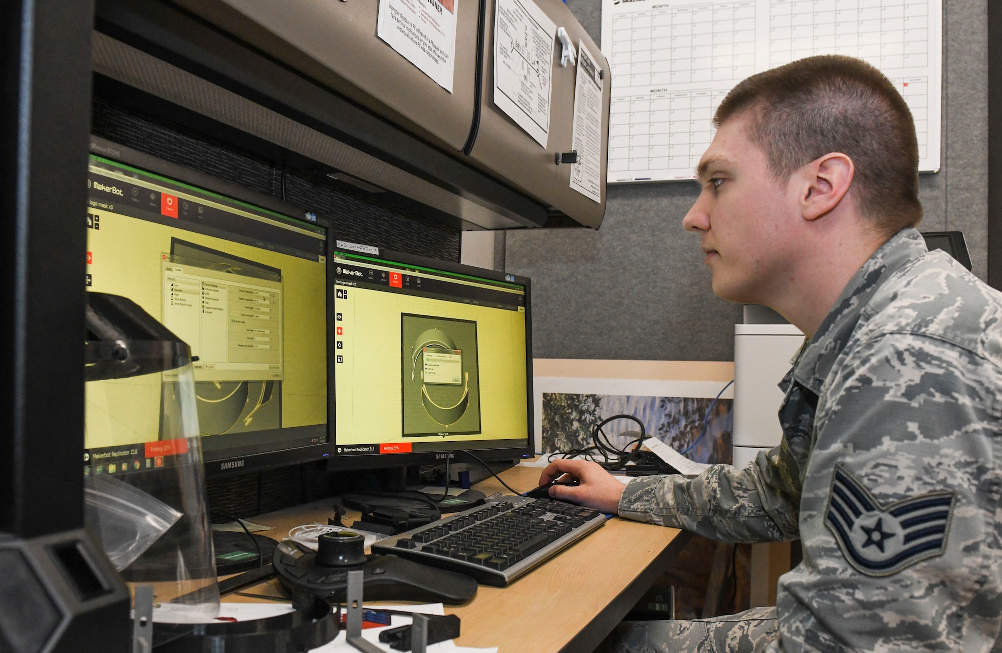 U.S. Air Force Staff Sgt. David Astleford, a 509th Maintenance Group research and engineering computer-aided drafting manager, showcases a 3D blueprint for a medical face shield prototype, at Whiteman Air Force Base, Missouri, April 13, 2020. The RE shop utilized the National Institute of Health’s approved face mask as a model to create their own version of a face shield, featuring an added foam piece on the forehead to provide more comfort and using an adjustable band verses an elastic rubber one. The RE shop works 24-hour operations in order to maintain the various requests supporting other base functions. (U.S. Air Force photo by Staff Sgt. Sadie Colbert)
