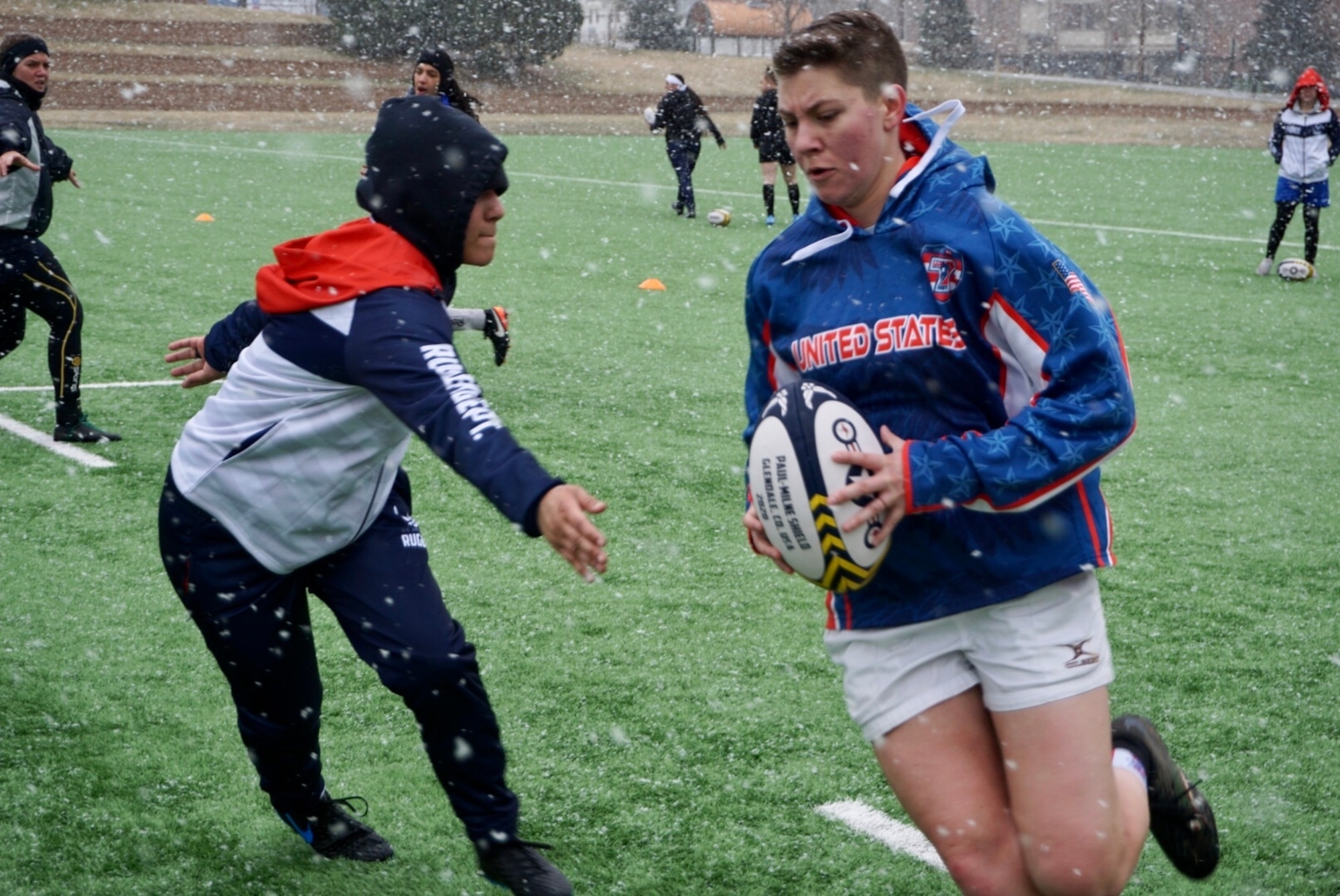 U.S. Air Force Airman 1st Class Jena White, 5th Security Forces Squadron response force
member assigned to Minot Air Force Base, N.D., runs with the ball during practice at Infinity
Park in Glendale, Colo., March 13, 2020. White and the U.S. Air Force Women’s Rugby Team
were preparing for a two week international tournament with the Royal Australian Air Force
Team and the Royal New Zealand Air Force Team. (U.S. Air Force photo by Capt. Michelle
Sierra-Kwandham)
