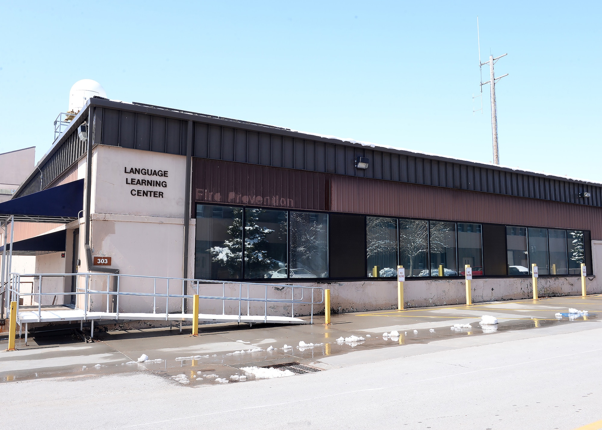 Image of Language Learning Certer with empty parking lot.