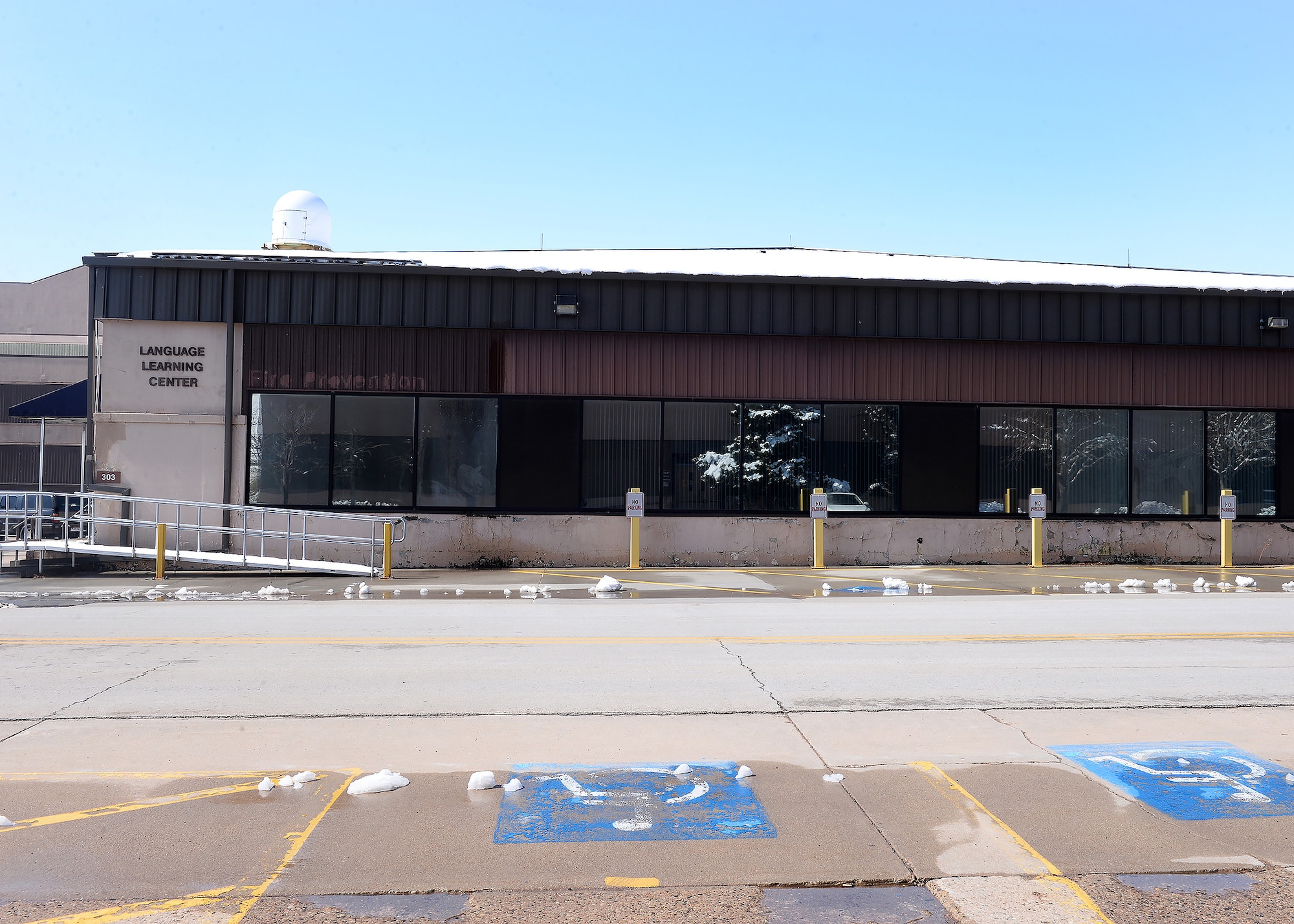 Image of Language Learning Certer with empty parking lot.