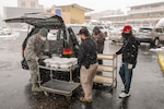 U.S. Air Force Airman 1st Class John Boyle, 233rd Space Group security forces specialist, Colorado Air National Guard, Greeley, gathers meals for people experiencing homelessness as a result of COVID-19 at a hotel in Denver, April 16, 2020.