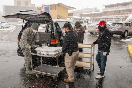 U.S. Air Force Airman 1st Class John Boyle, 233rd Space Group security forces specialist, Colorado Air National Guard, Greeley, gathers meals for people experiencing homelessness as a result of COVID-19 at a hotel in Denver, April 16, 2020.