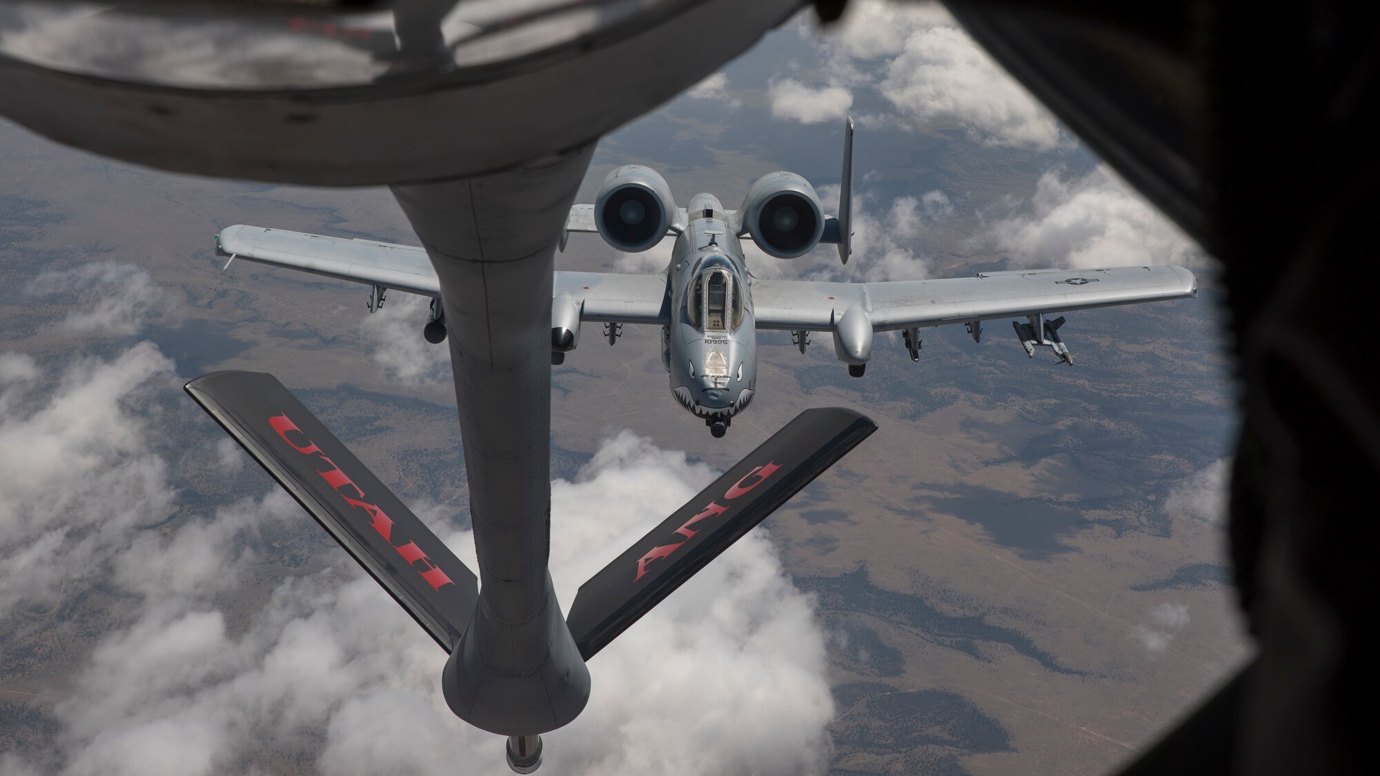 A KC-135R assigned to the Utah Air National Guard's 151st Air Refueling Wing conducts air refueling operations with A-10s