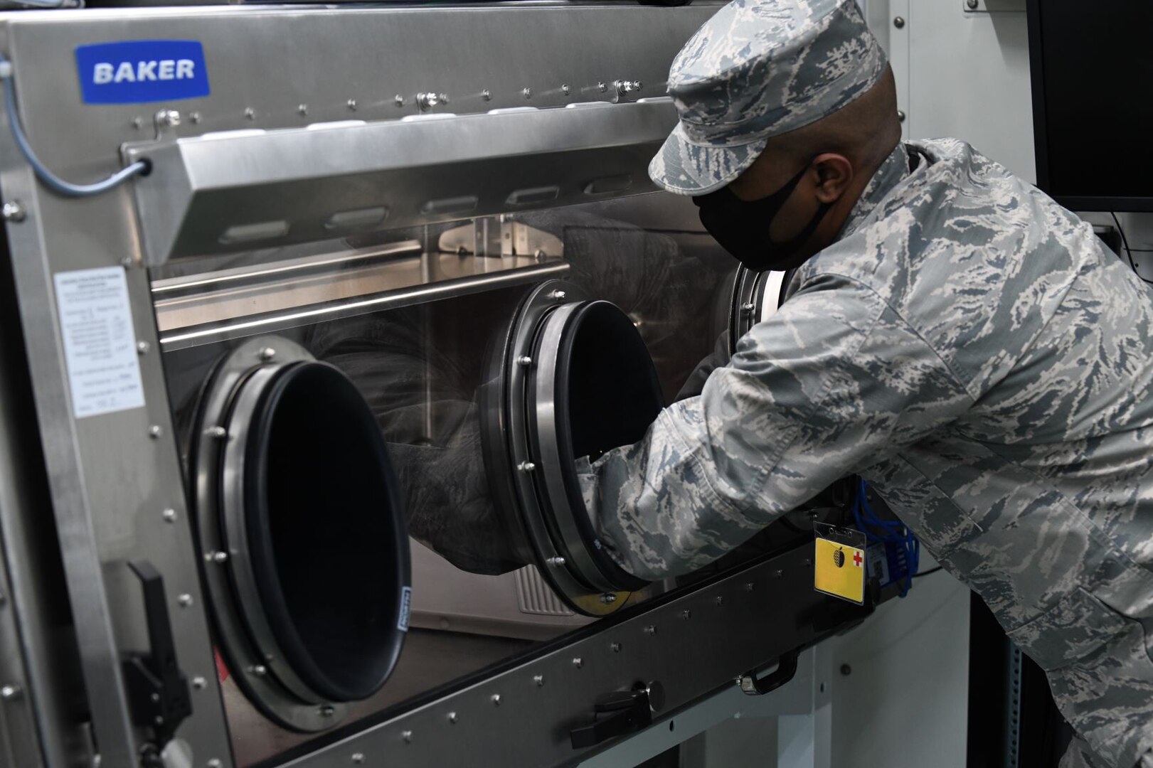 An Airman assigned to the New York National Guard's 24th Civil Support Team conducts a COVID-19 test analysis at the Javits New York Medical Station in New York City April 16, 2020. The 22 members of the 24th CST, who train to detect biological and chemical hazards, are providing COVID-19 testing to medical personnel at the site.