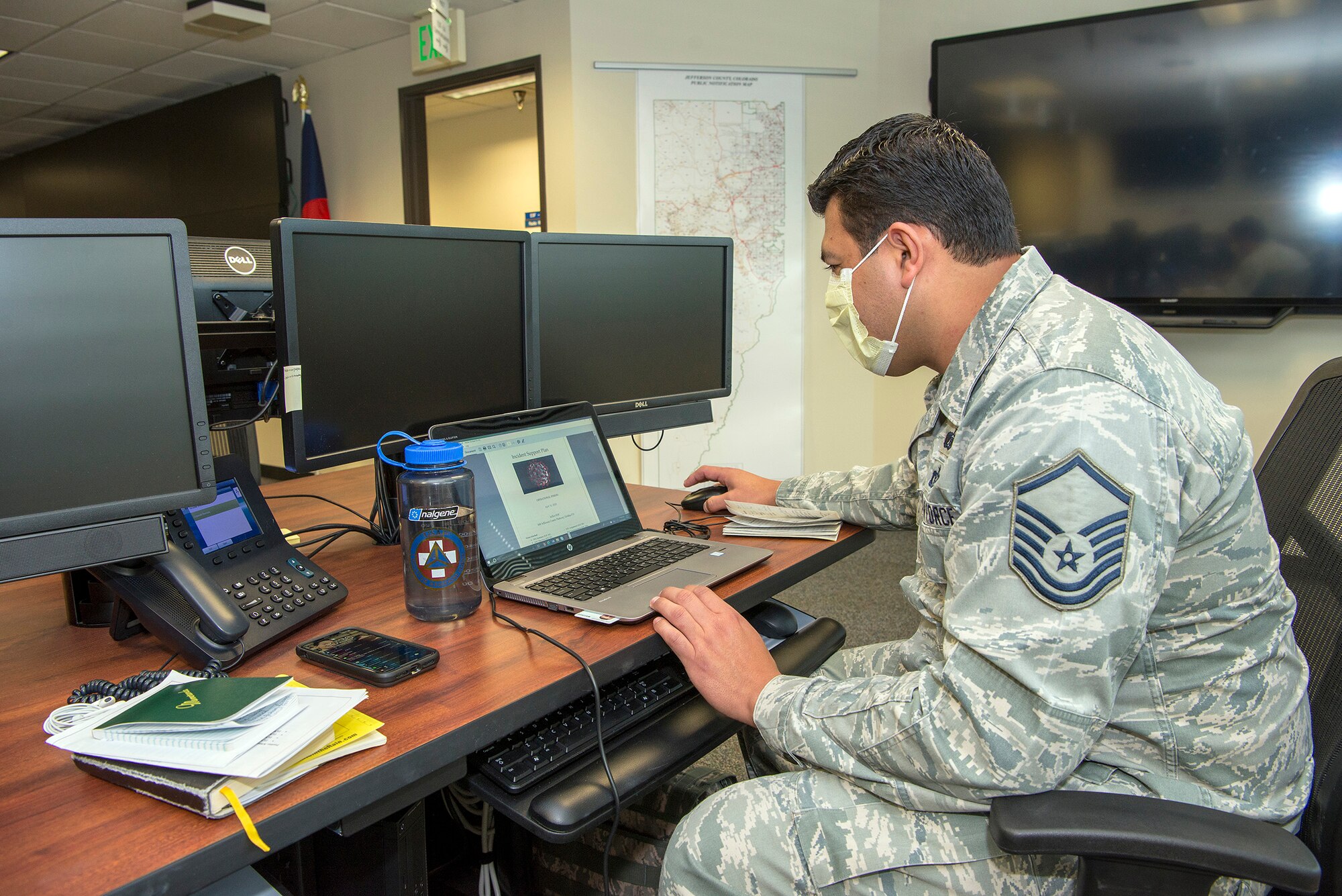 Airman working on Coputer in emergency operations center