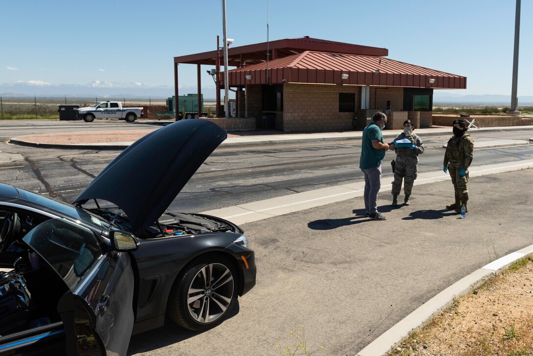 Airmen with 412th Security Forces Squadron, 412th Test Wing at Edwards Air Force Base, California, conducts a vehicle search at the West gate at Edwards AFB, April 16. (Photo by Richard Gonzales).