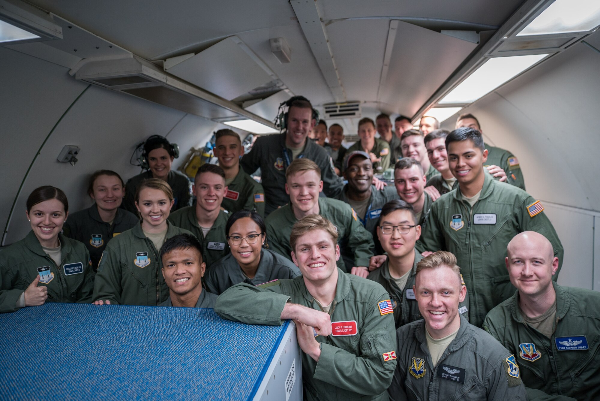 Air Force cadets pose for a photo onboard an Air Force aircraft