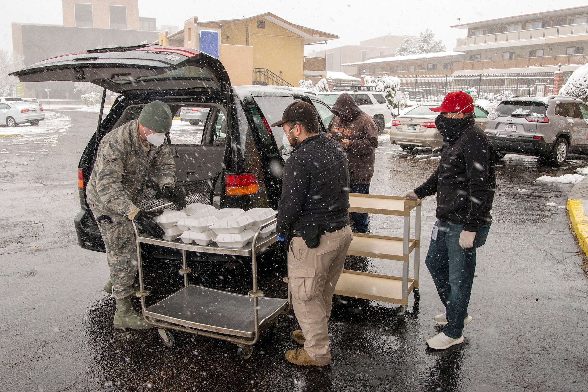 U.S. Air Force Airman 1st Class John Boyle, 233rd Space Group security forces specialist, Colorado Air National Guard, Greeley, gathers meals for people experiencing homelessness as a result of COVID-19 at a hotel in Denver, April 16, 2020.