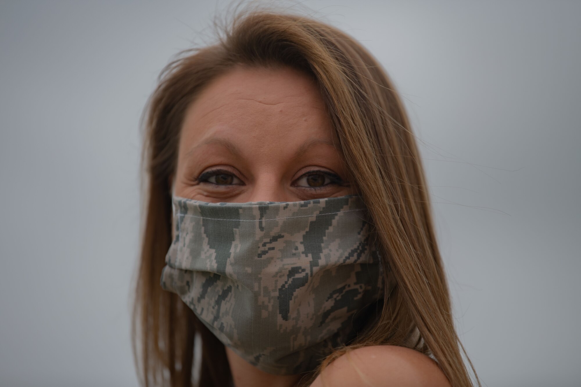 Kelly Miller, Dyess Spouse's Club president, smiles under a face-mask at Dyess Air Force Base, Texas, April 14, 2020.