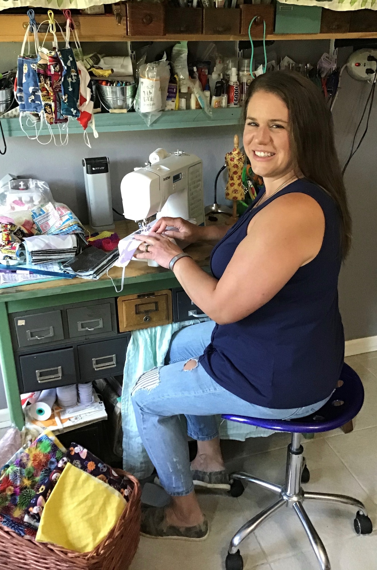 Amanda Peterson, spouse of U.S. Air Force Tech. Sgt. Parker Peterson, crafts masks to help those in need at and around Little Rock Air Force Base, Arkansas.