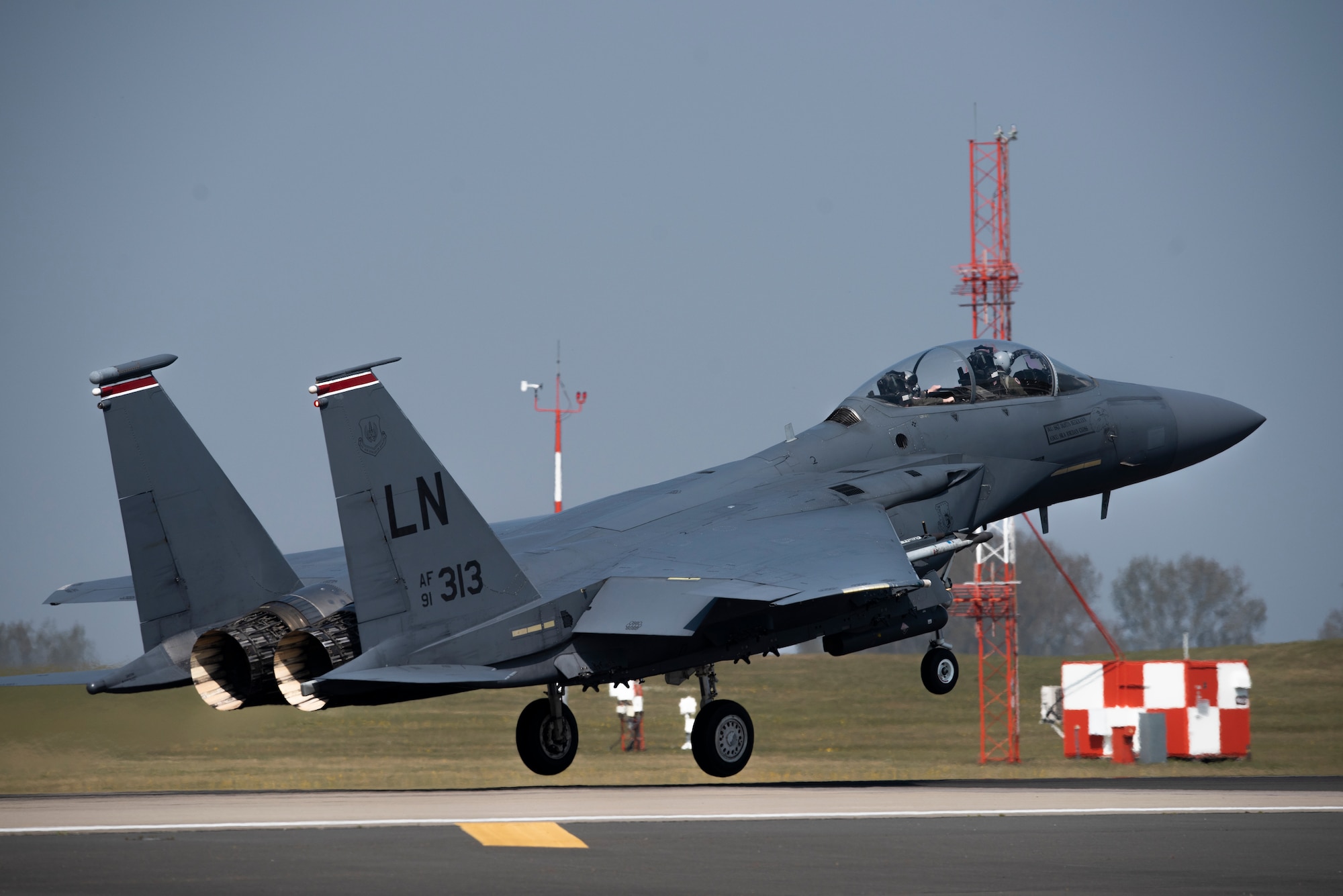 An F-15E Strike Eagle assigned to the 494th Fighter Squadron takes off at Royal Air Force Lakenheath, England, April 16, 2020. Despite the current COVID-19 crisis, the 48th Fighter Wing has a commitment to be ready to deliver combat air power when called upon by U.S. Air Forces in Europe-Air Forces Africa. (U.S. Air Force photo by Airman 1st Class Jessi Monte)