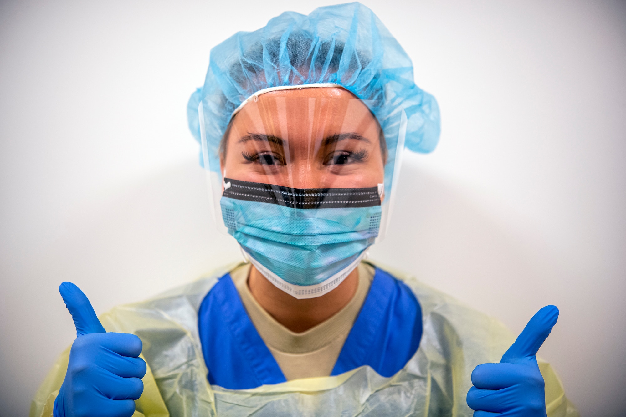 U.S. Air Force Senior Airman Amber Potter, 423d Medical Squadron dental assistant, poses for a portrait  at RAF Alconbury, England, April 14, 2020. In an effort to control the COVID-19 pandemic, the 423d MDS has been conducting drive-thru COVID-19 testing along with passing out face coverings to those in need. (U.S. Air Force photo by Senior Airman Eugene Oliver)