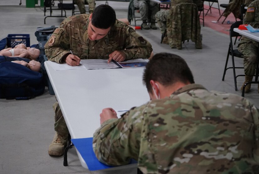 Soldiers and Airmen from the Pennsylvania National Guard perform the written evaluation of the American Red Cross CPR certification on April 13, 2020