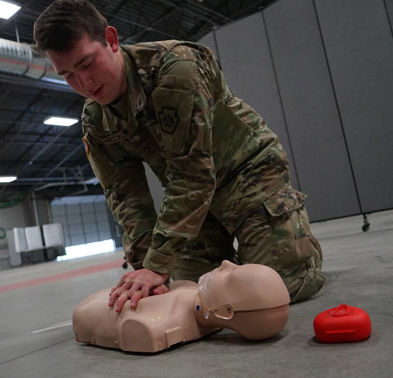 Soldiers and Airmen from the Pennsylvania National Guard perform the written evaluation of the American Red Cross CPR certification on April 13, 2020