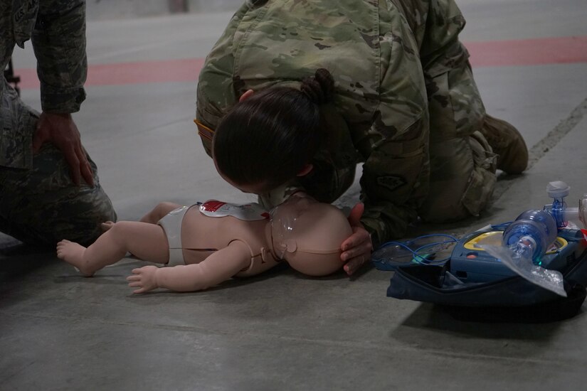 Soldiers and Airmen from the Pennsylvania National Guard perform the written evaluation of the American Red Cross CPR certification on April 13, 2020