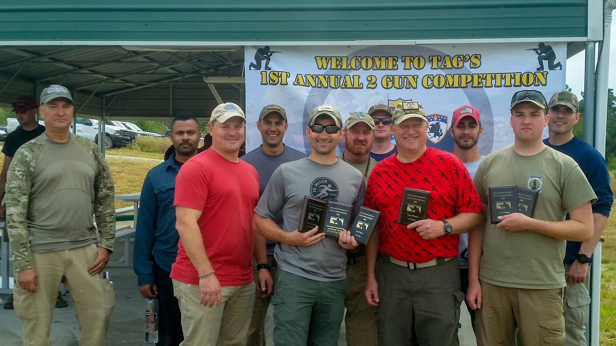 Current and retired members of the Kentucky Air National Guard competed at the Adjutant General’s Two-Gun Pistol and Rifle Scramble match at the Wendell H. Ford Regional Training Center Sept. 26, 2019. Back row from left to right: John Siebert, Miah Helm, Eric Skaggs, Frank Tallman (retired), Jacob Faith, Yuri Motamedi and Frank Morgan. Front row from left to right: Kevin Krauss, David Farc, Darryl Loafman and Austin Goldman. Farc took Two-Gun Top Gun, followed by Loafman and Goldman. (Courtesy Photo)