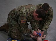 Soldiers and Airmen from the Pennsylvania National Guard perform the written evaluation of the American Red Cross CPR certification on April 13, 2020