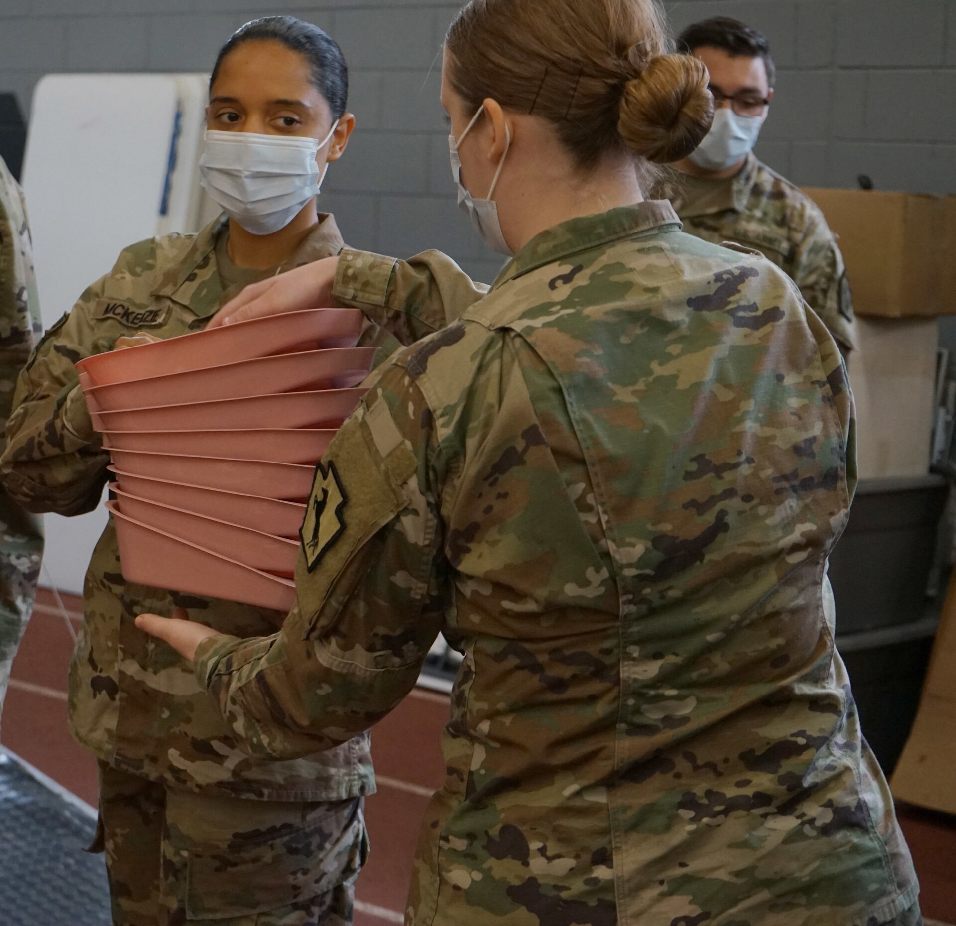 Soldiers from the Pennsylvania National Guard help unload supplies from a Pennsylvania Department of Health trailer at East Stroudsburg University's Koehler Fieldhouse on April 14, 2020.