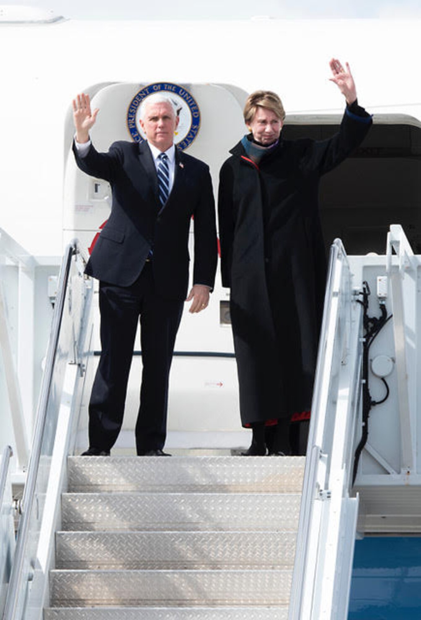 PETERSON AIR FORCE BASE, Colo. – Vice President Mike Pence along with the Secretary of the Air Force Barbara Barrett, wave to onlookers as he exits Air Force One on Peterson Air Force Base, Colorado, April 18, 2020. Pence came to Colorado Springs to speak at the U.S. Air Force Academy graduation which included 86 cadets from USAFA to commission directly into the U.S. Space Force, becoming the very first company grade officers in the new service. (U.S. Air Force photo by Staff Sgt. Alexandra M. Longfellow)