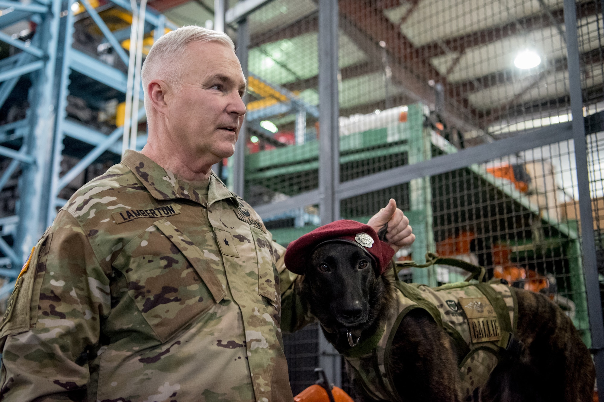 Brig. Gen. Haldane Lamberton, Kentucky’s newly appointed adjutant general, meets Callie, the only search-and-rescue dog in the Department of Defense, during a tour of the Kentucky Air National Guard Base in Louisville, Ky., on Jan. 28, 2020. Lamberton visited various work centers, learning about the unique mission sets of the 123rd Airlift Wing. (U.S. Air National Guard photo by Staff Sgt. Joshua Horton)