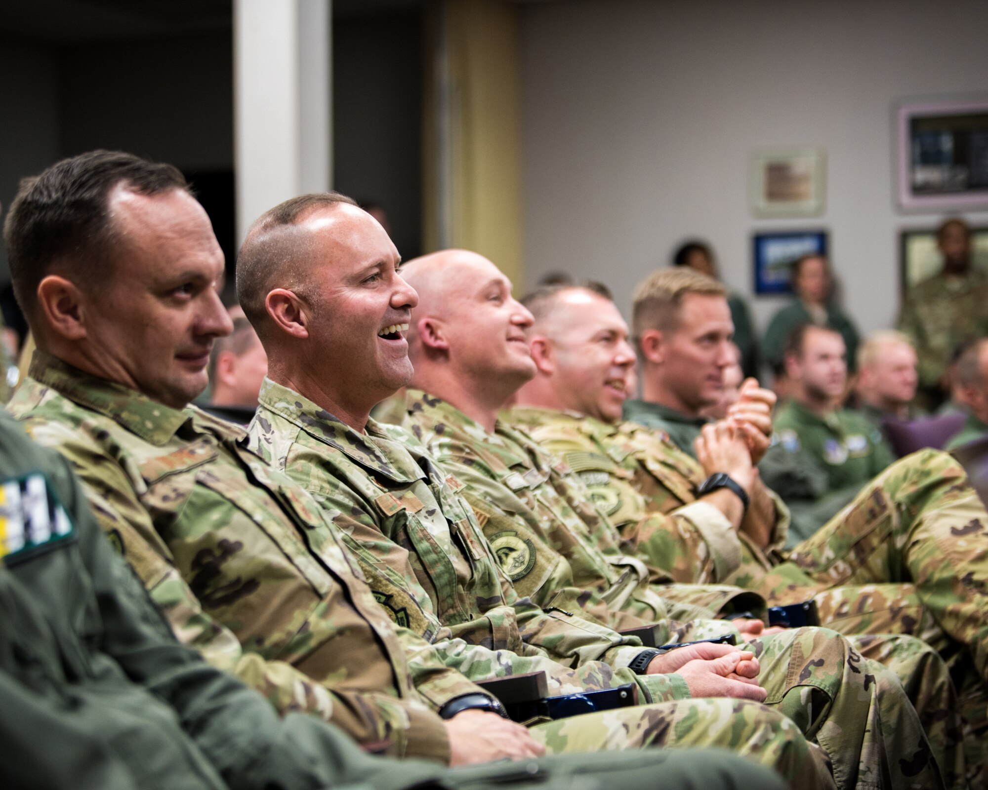 Audience members react as Chief Master Sgt. Jeffrey Brown talks about his 38-year career during his retirement ceremony at the Kentucky Air National Guard Base in Louisville, Ky., Dec. 7, 2019. (U.S. Air National Guard photo by Senior Airman Chloe Ochs)