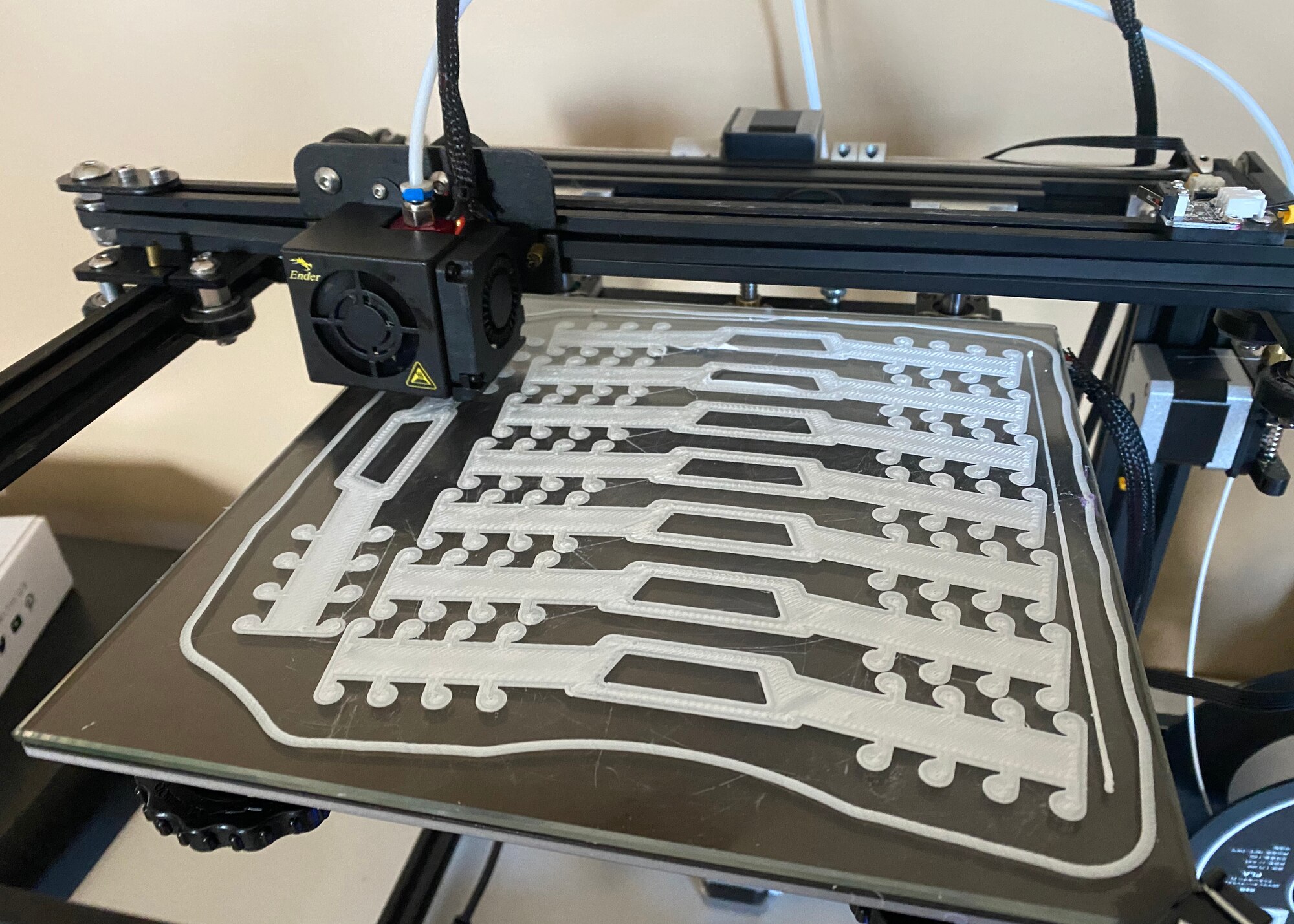 More than 50 members of the 104th Fighter Wing have been activated and are working within their career fields to assist with the COVID-19 response efforts within the Commonwealth.  Although Staff Sgt. Whitney Greaney has not been activated, she decided to help her community with her personal 3D printer.  Greaney is printing mask extenders on her 3D printer at home and donating them to those who need them most.  (Courtesy photo)