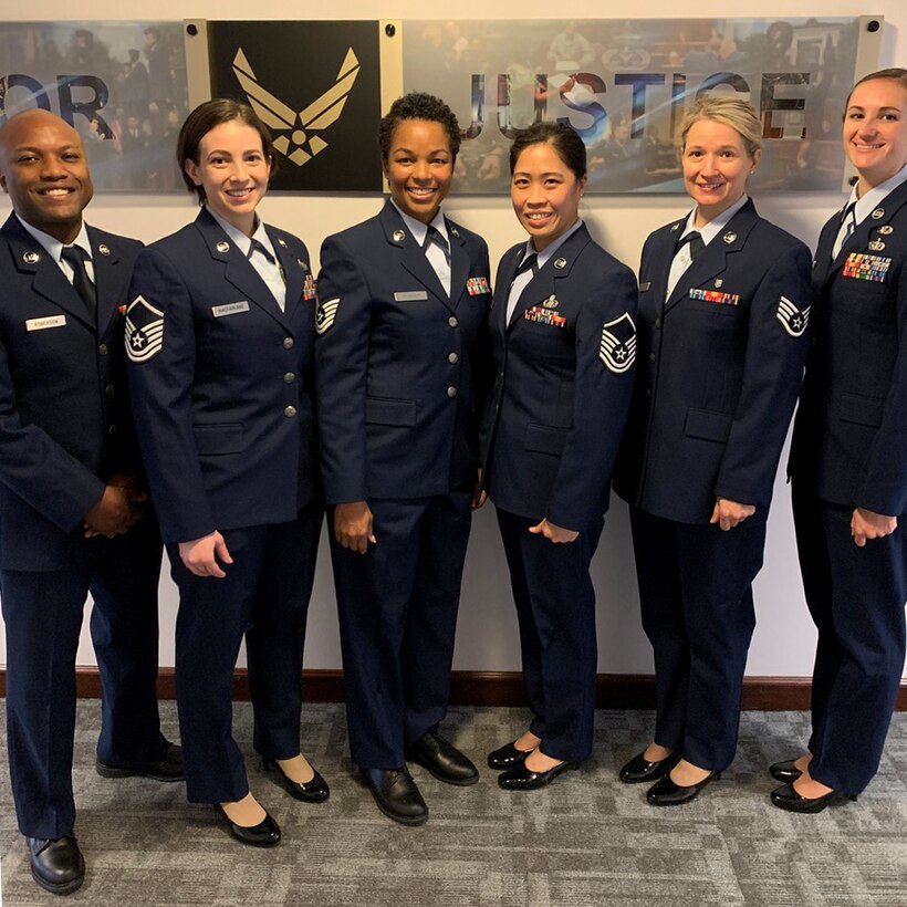 Staff Sgt. Maurice Roberson, 104th Fighter Wing paralegal, poses for a photo with his technical school friends on photo day at the Air Force Judge Advocate General School, Montgomery, Alabama. Roberson received the award of distinguished honor graduate for his outstanding performance at tech school. (courtesy photo)