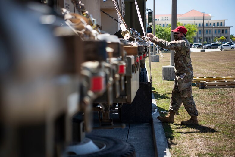 An Airman from the 554th RED HORSE Squadron prepares to unload medical supplies for the Expeditionary Medical Support System facility April 13, 2020, at U.S. Naval Hospital Guam.
