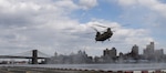 A CH-47 Chinook helicopter, assigned to the New York Army National Guard's Company B, 3rd Battalion, 126th Aviation, approaches a helipad in New York City, April 16, 2020. New York National Guard members are supporting the multi-agency response to COVID-19.