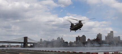 A CH-47 Chinook helicopter, assigned to the New York Army National Guard's Company B, 3rd Battalion, 126th Aviation, approaches a helipad in New York City, April 16, 2020. New York National Guard members are supporting the multi-agency response to COVID-19.