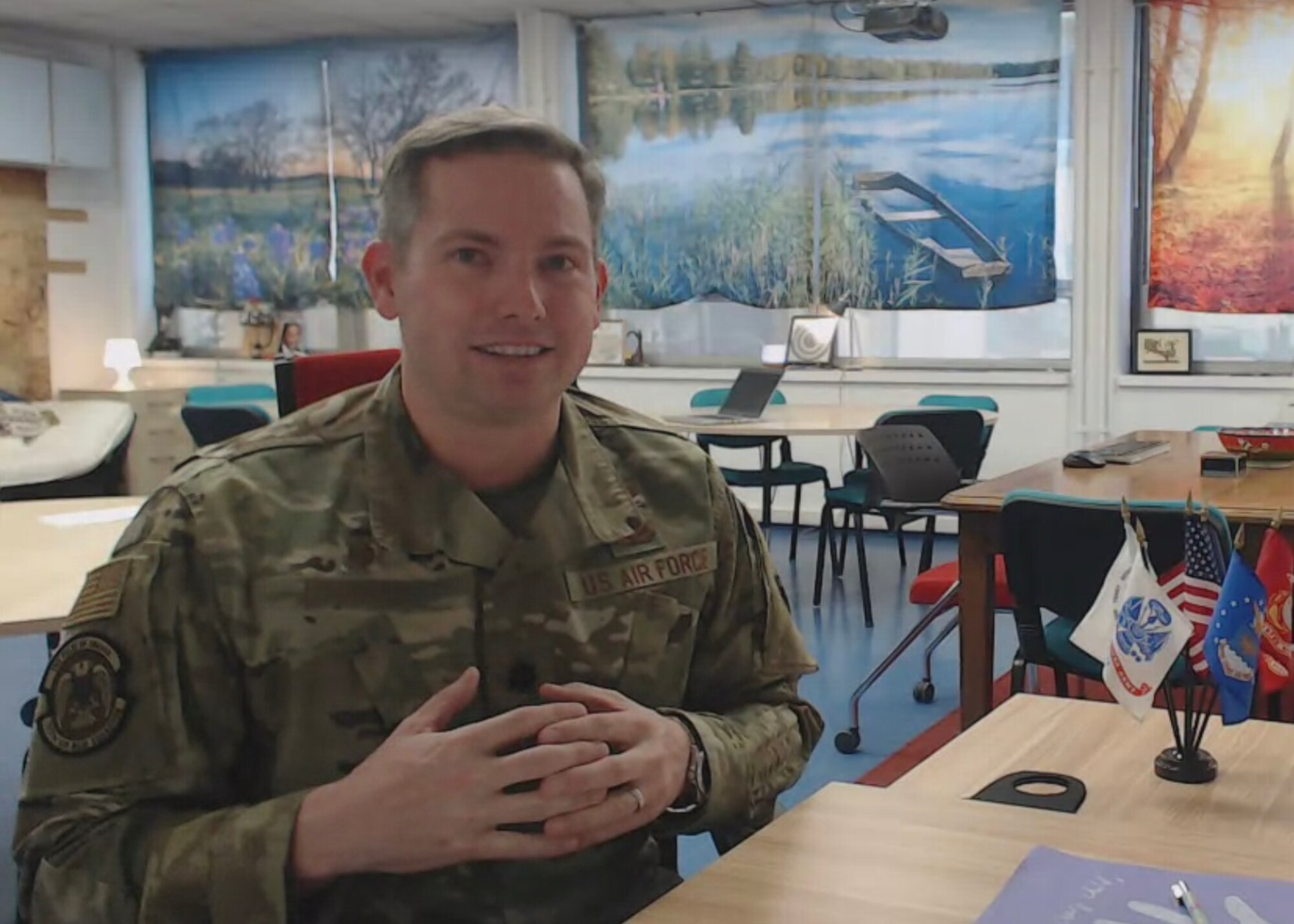 Photo of Airman giving a virtual speech to children and families of military connected children