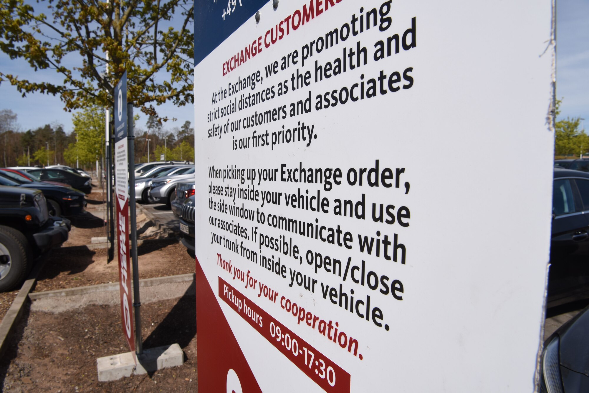 An Army and Air Force Exchange Service sign provides customers with information about alternative pick up service options at Ramstein Air Base, Germany, April 15, 2020.