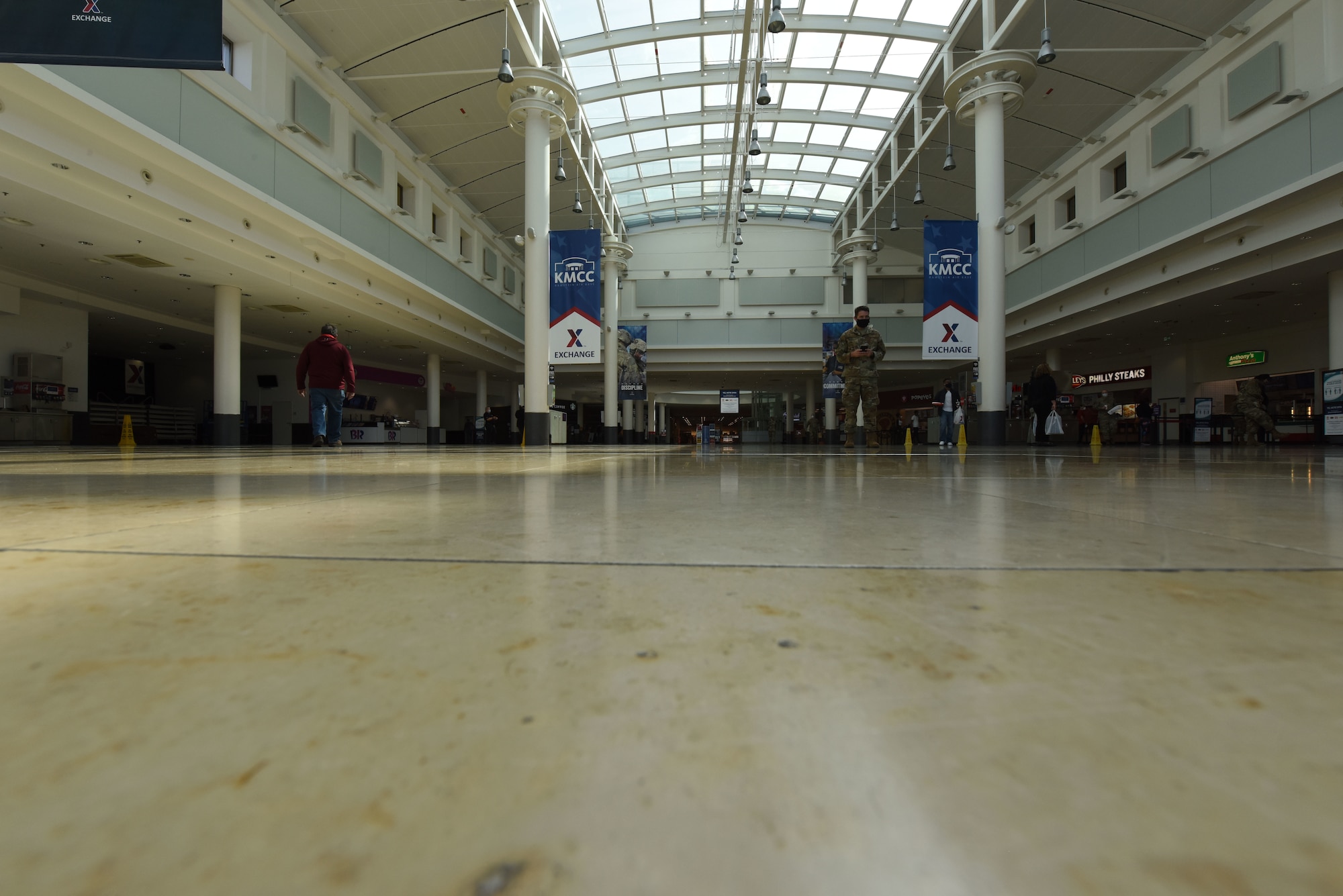 Kaiserslautern Military Community members walk through the KMC Center food court at Ramstein Air Base, Germany, April 15, 2020.