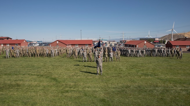 Airmen assigned to the Utah Air National Guard and 151st Air Refueling Wing stand ready for the pass-and-review at the annual Governor’s Day celebration at Camp Williams, Utah, September 14, 2019