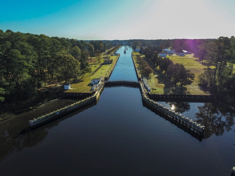 Boats traveling south along the Albemarle and Chesapeake Canal pass through the Great Bridge Locks in Chesapeake, Va.
