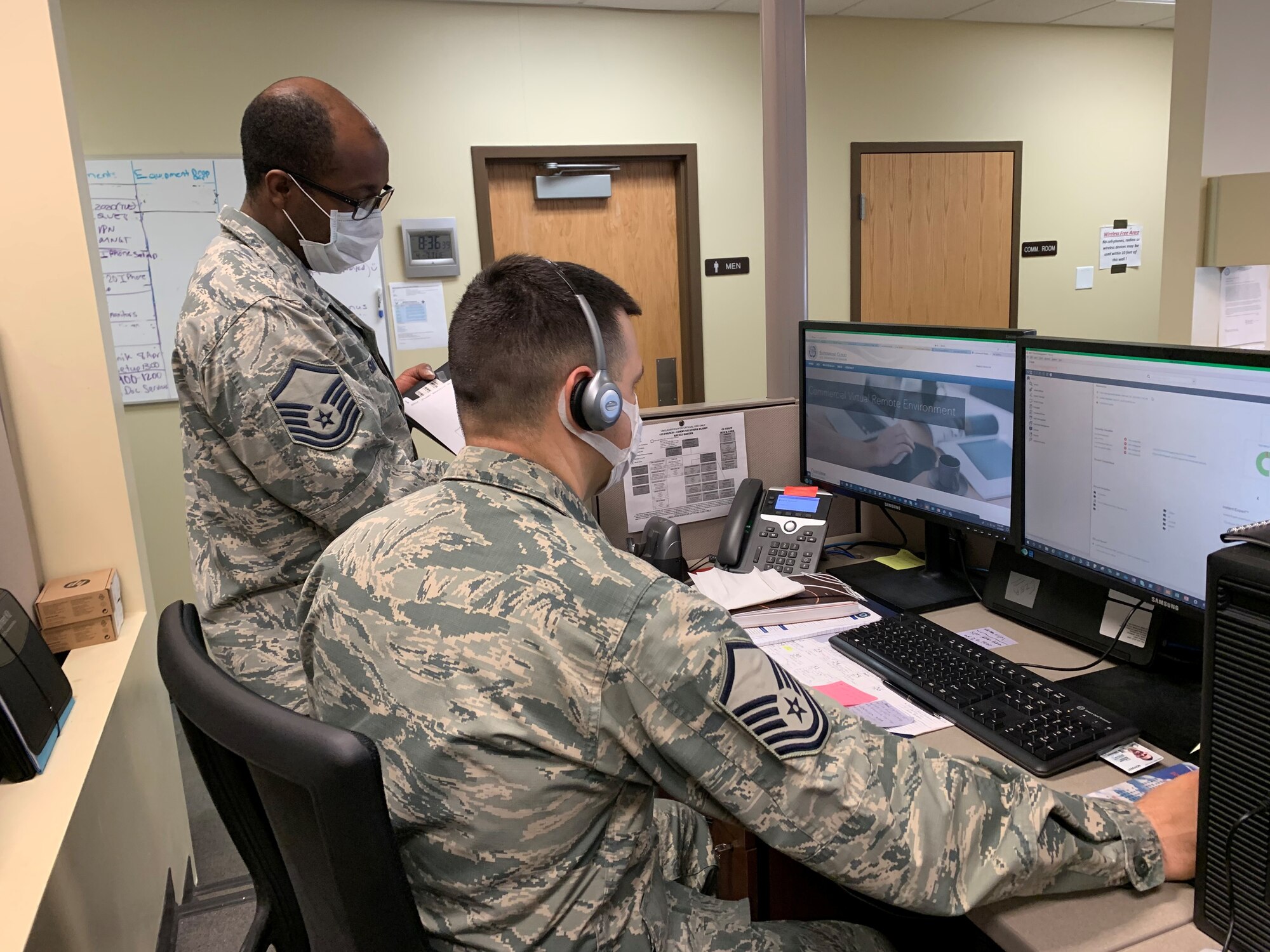 Master Sgt. Ezer Guimaraes (right) and Master Sgt. Dayton Smith from the 419th Cyber Flight push updates and patch software to computers across the 419th Fighter Wing to keep the wing safe and connected during the COVID-19 pandemic.