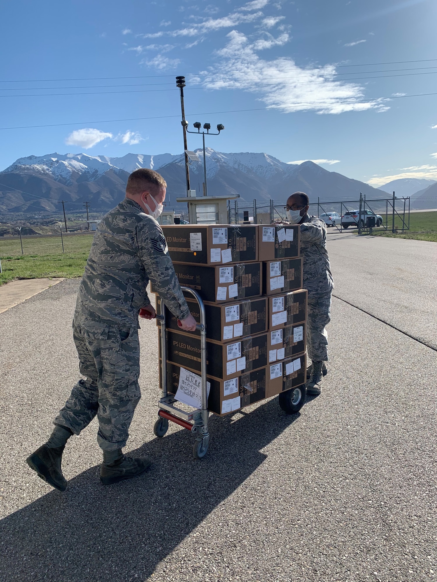 Master Sgt. Dayton Smith (right) and Tech. Sgt. Robert Daniels deliver computer monitors to equipment custodians across the 419th Fighter Wing. During a time when connectivity is crucial, 419th Cyber Flight personnel continue to provide the latest technology to members during the COVID-19 pandemic.