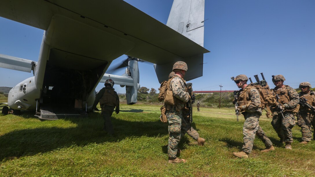 U.S. Marines with Marine Medium Tiltrotor Squadron 165, Marine Aircraft Group 16, 3rd Marine Aircraft Wing (MAW), and 2nd Battalion, 4th Marine Regiment, 1st Marine Division, load a MV-22 Osprey for a Tactical Recovery of Aircraft and Personnel (TRAP) on Marine Corps Base Camp Pendleton, Calif., April 14,2020. The training was held to ensure consistent operational capability, as 3rd MAW remains ready to support short notice, worldwide deployments while following necessary precautions to protect the health of the force. (U.S. Marine Corps photo by Lance Cpl. Jaime Reyes)