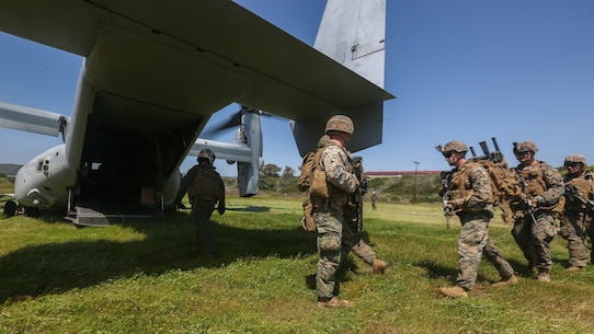 U.S. Marines with Marine Medium Tiltrotor Squadron 165, Marine Aircraft Group 16, 3rd Marine Aircraft Wing (MAW), and 2nd Battalion, 4th Marine Regiment, 1st Marine Division, load a MV-22 Osprey for a Tactical Recovery of Aircraft and Personnel (TRAP) on Marine Corps Base Camp Pendleton, Calif., April 14,2020. The training was held to ensure consistent operational capability, as 3rd MAW remains ready to support short notice, worldwide deployments while following necessary precautions to protect the health of the force. (U.S. Marine Corps photo by Lance Cpl. Jaime Reyes)