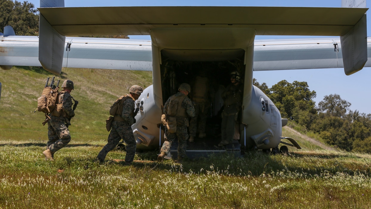 U.S. Marines with Marine Medium Tiltrotor Squadron 165, Marine Aircraft Group 16, 3rd Marine Aircraft Wing (MAW), and 2nd Battalion, 4th Marine Regiment, 1st Marine Division, load a MV-22 Osprey for a Tactical Recovery of Aircraft and Personnel (TRAP) on Marine Corps Base Camp Pendleton, Calif., April 14,2020. The training was held to ensure consistent operational capability, as 3rd MAW remains ready to support short notice worldwide deployments while following necessary precautions to protect the health of the force. (U.S. Marine Corps photo by Lance Cpl. Jaime Reyes)
